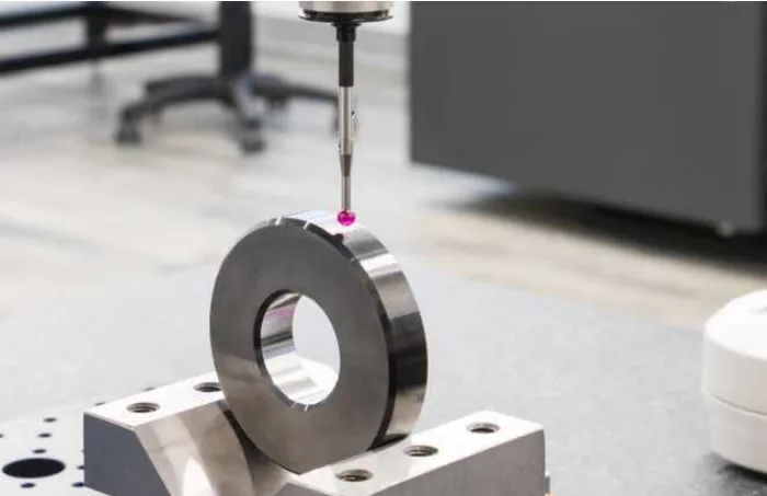 Precision measuring of a machined metal part