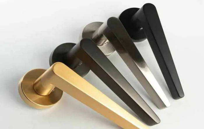 Door handles in brushed stainless steel and PVD finishes